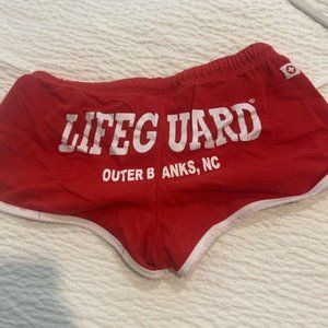 Size Large lifeguard shorts from outer banks NC red with white lettering